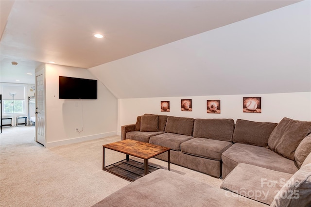 living area with recessed lighting, baseboards, vaulted ceiling, and light colored carpet