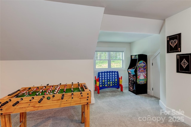 rec room featuring vaulted ceiling, carpet floors, and baseboards