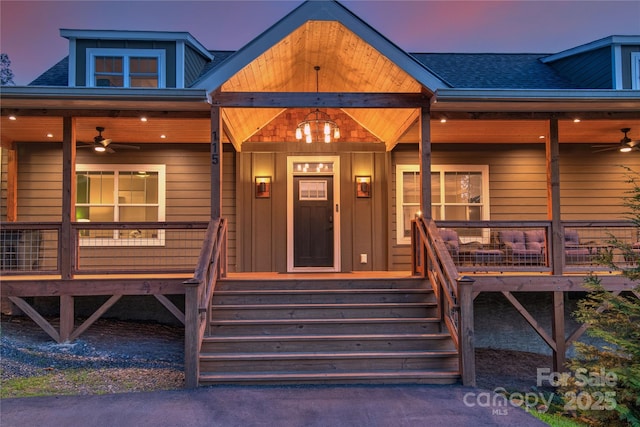 view of front of house featuring covered porch, a shingled roof, and a ceiling fan