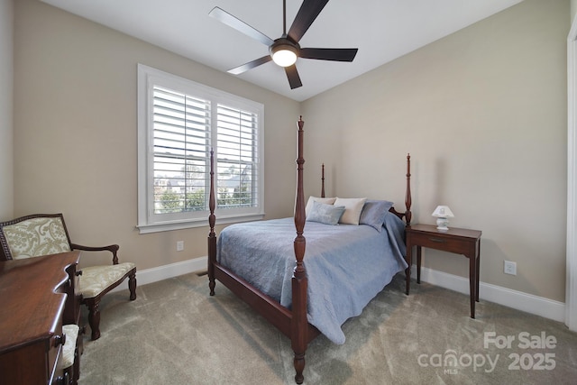 carpeted bedroom with ceiling fan and baseboards