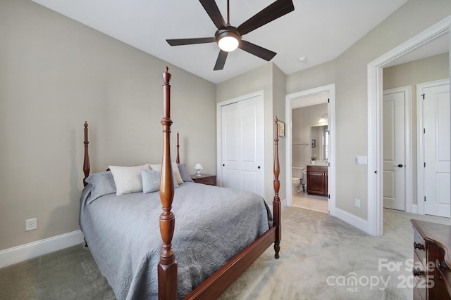 bedroom with light carpet, ceiling fan, ensuite bath, and baseboards