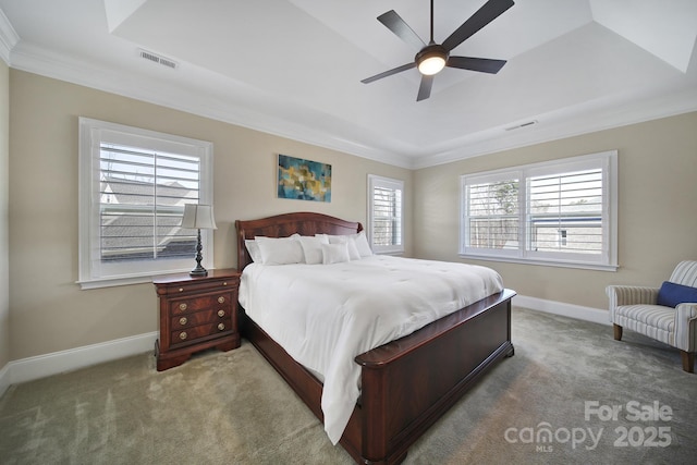 carpeted bedroom featuring visible vents, baseboards, and ornamental molding