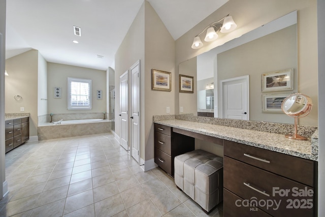 full bathroom with tile patterned floors, visible vents, baseboards, a bath, and vanity