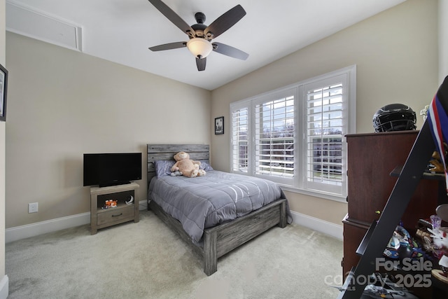 bedroom featuring baseboards, carpet floors, and a ceiling fan