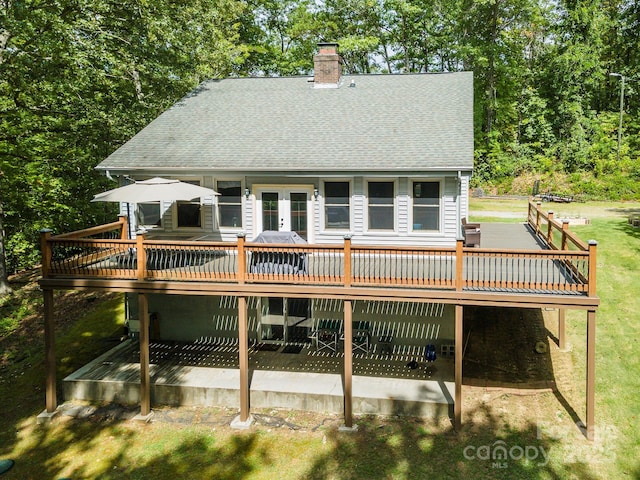 back of house featuring french doors and a deck