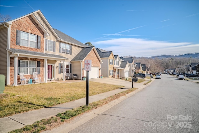 view of street featuring curbs, sidewalks, and a residential view