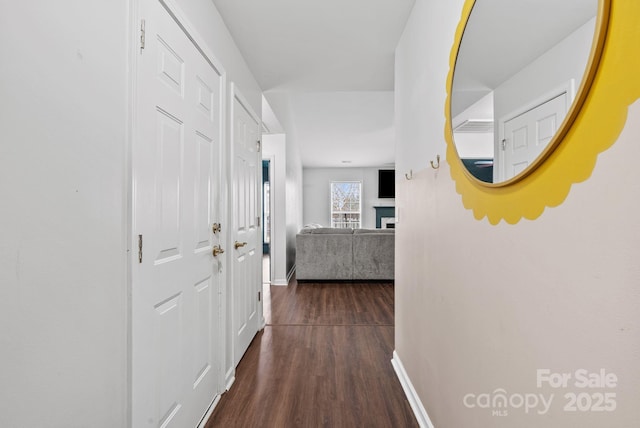 hall with dark hardwood / wood-style floors