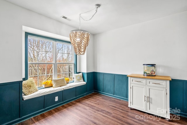 unfurnished dining area featuring dark hardwood / wood-style floors