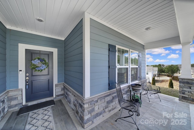 doorway to property with covered porch