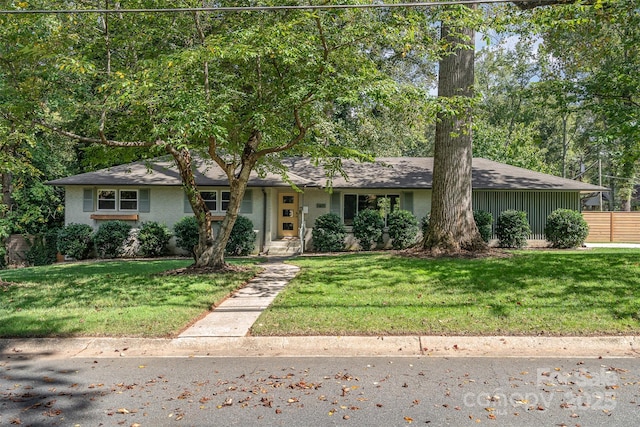 ranch-style house with a front lawn