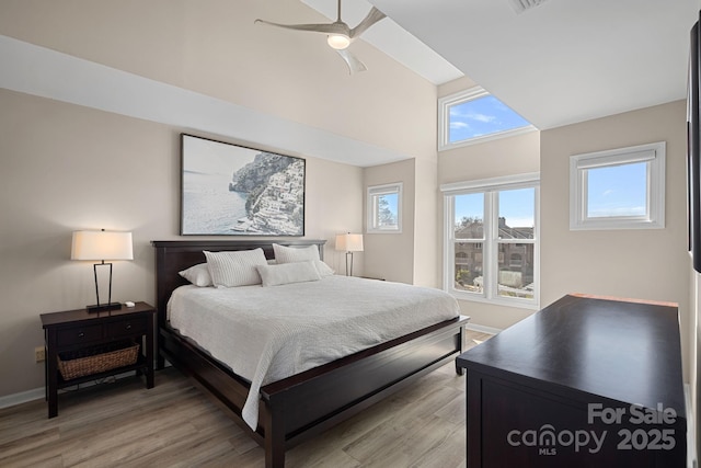 bedroom with ceiling fan and light wood-type flooring