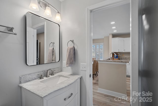 bathroom featuring vanity and wood-type flooring