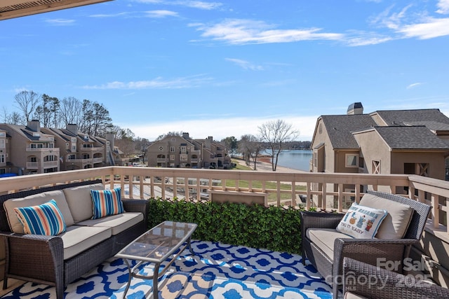 view of patio / terrace with an outdoor living space and a water view