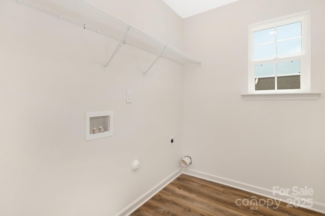 laundry area featuring hookup for a washing machine, hookup for an electric dryer, laundry area, baseboards, and dark wood finished floors