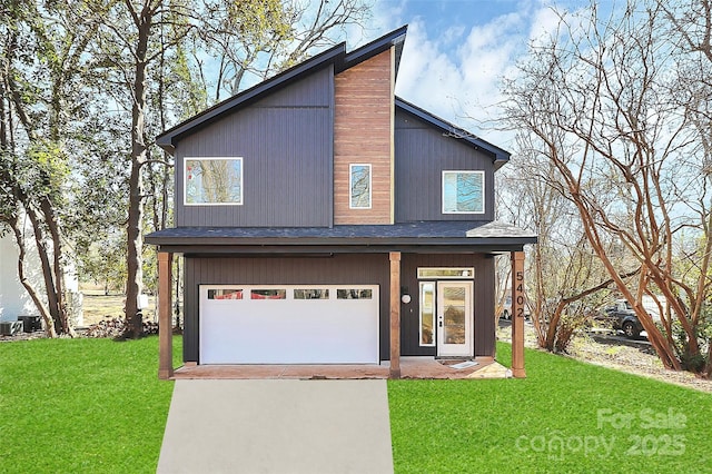 view of front of property with a garage and a front yard