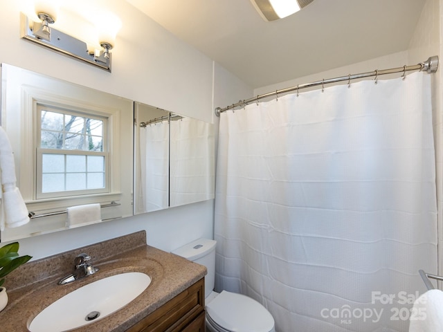 full bathroom with vanity and toilet