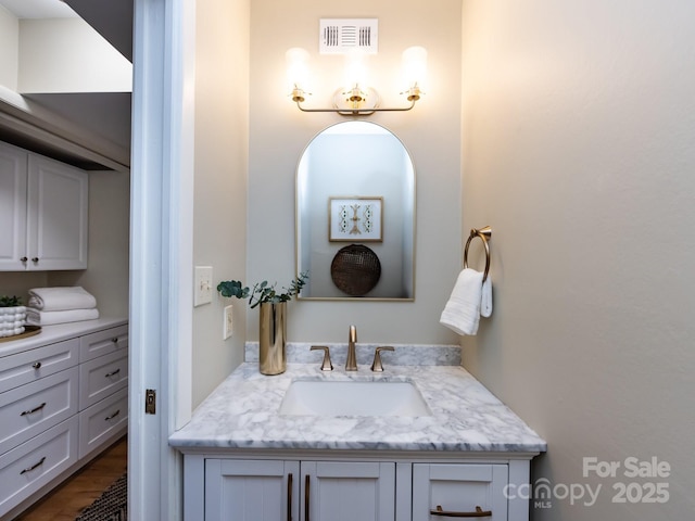 bathroom with visible vents and vanity