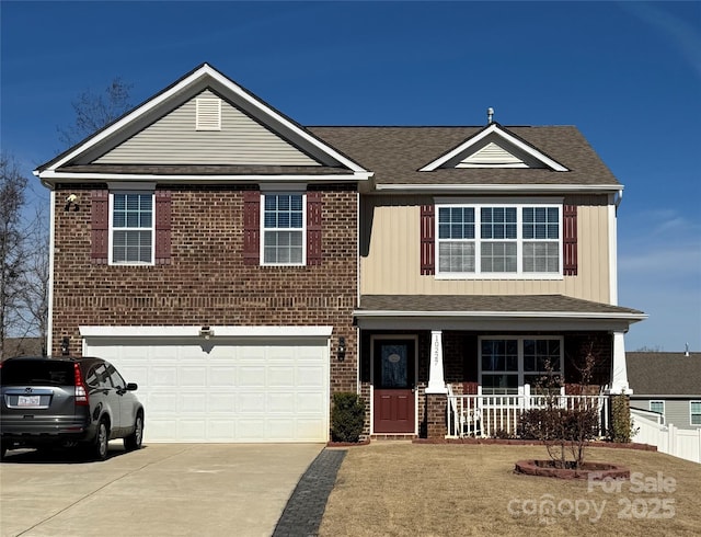 view of front facade featuring a garage and covered porch