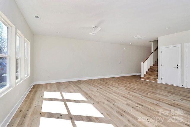 unfurnished room featuring ceiling fan and light hardwood / wood-style flooring