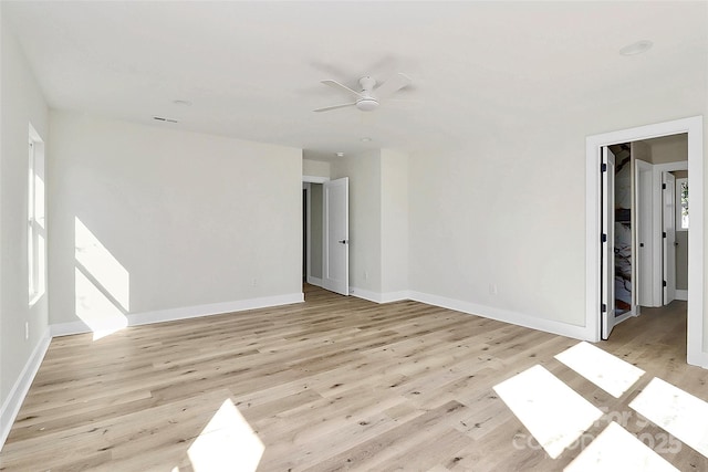 spare room featuring light hardwood / wood-style flooring and ceiling fan