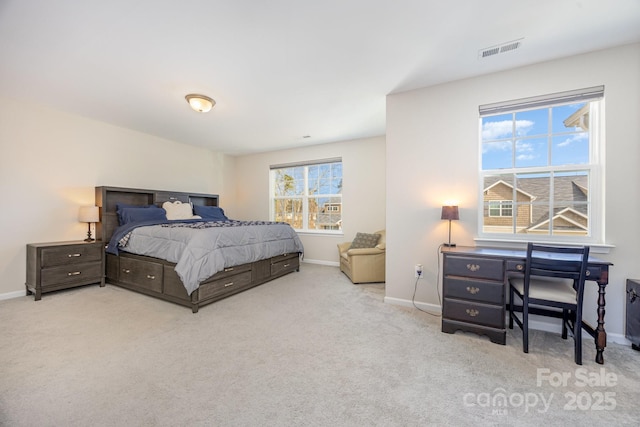 bedroom featuring light colored carpet