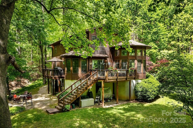 33 Cammies Way, Old Fort, NC 28762 - view of playground with a patio area, a deck, stairs, a yard, and a view of trees