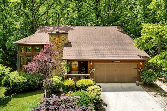 33 Cammies Way, Old Fort, NC 28762 - rustic home with an attached garage, driveway, a chimney, stone siding, and a view of trees