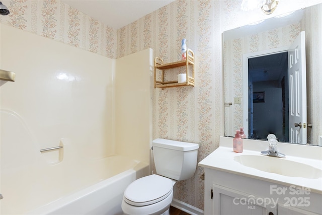 full bathroom featuring vanity, tub / shower combination, and toilet