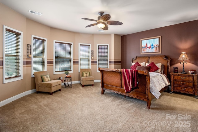 bedroom with light carpet and ceiling fan