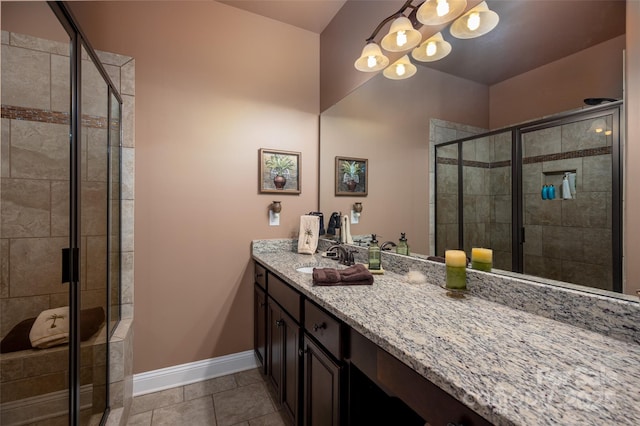 bathroom with vanity, tile patterned flooring, and a shower with door