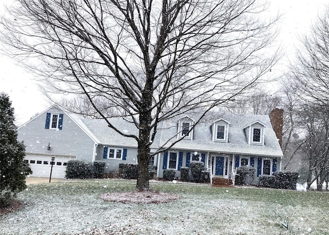 cape cod home with a front yard and a chimney