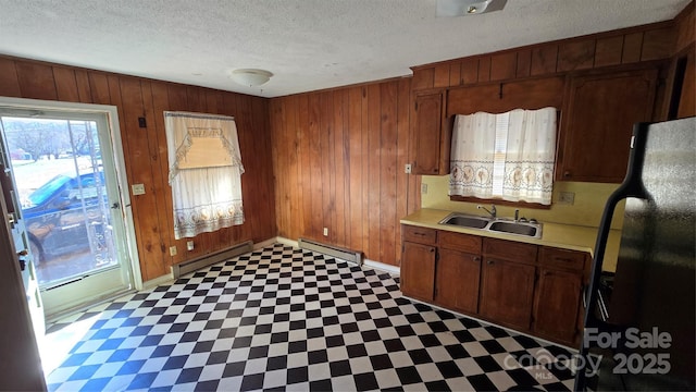 509 California Cir, York, SC 29745 - kitchen featuring black refrigerator, sink, and wood walls