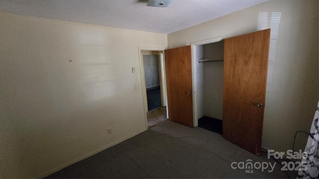 509 California Cir, York, SC 29745 - unfurnished bedroom with carpet, a closet, and a textured ceiling
