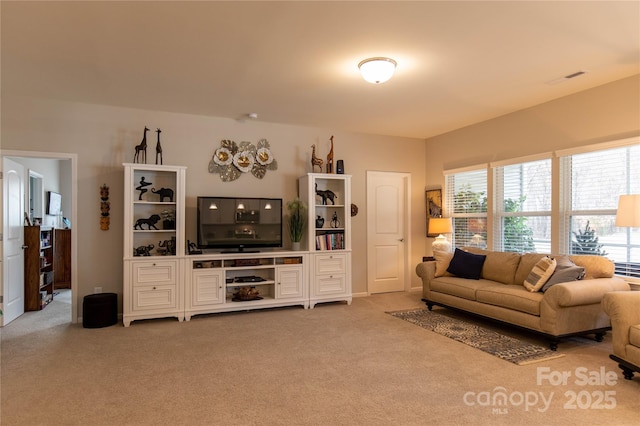 living area featuring light carpet and visible vents