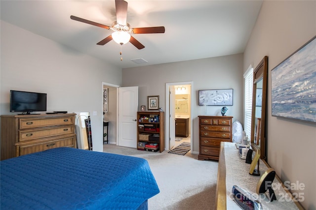 bedroom with ensuite bathroom, carpet flooring, visible vents, a ceiling fan, and baseboards