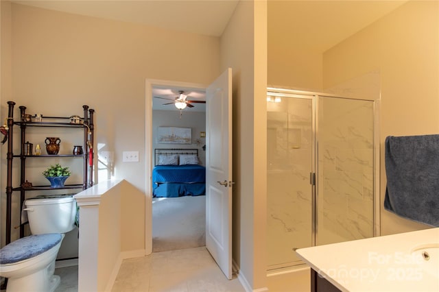 full bath with a stall shower, tile patterned flooring, vanity, and toilet