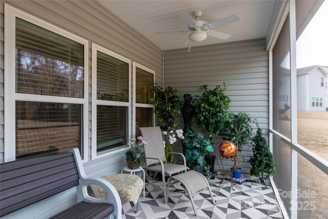 sunroom with a ceiling fan