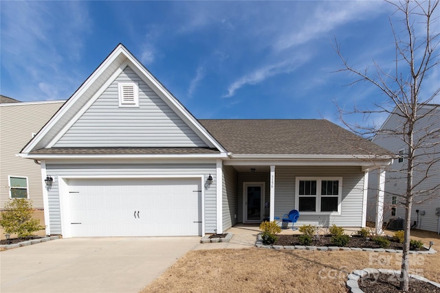 ranch-style home with driveway, an attached garage, a porch, and roof with shingles