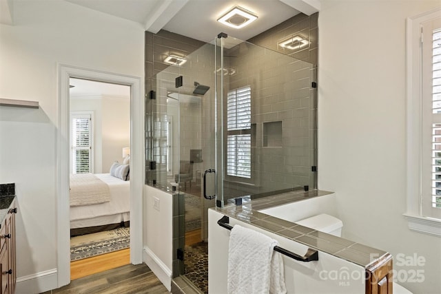 bathroom featuring vanity, hardwood / wood-style floors, and walk in shower