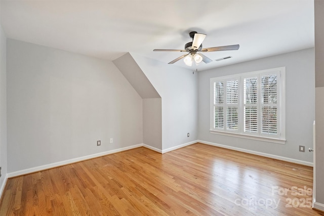 bonus room featuring ceiling fan and light hardwood / wood-style flooring