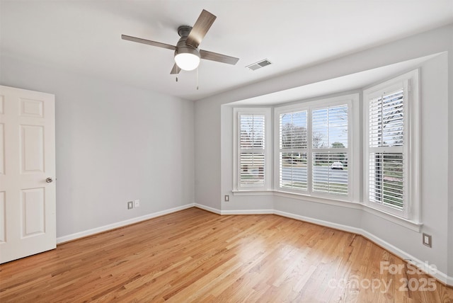 unfurnished room featuring ceiling fan and light hardwood / wood-style floors