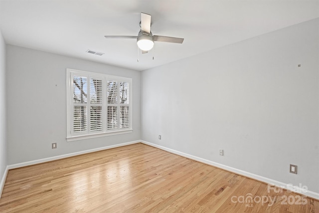 spare room featuring ceiling fan and light hardwood / wood-style floors