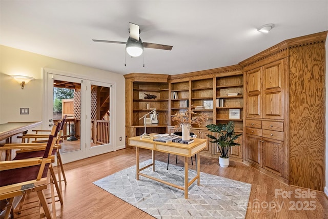 office area featuring light hardwood / wood-style floors and ceiling fan