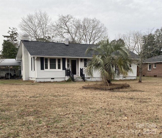 ranch-style home with a shingled roof, a front yard, crawl space, and a chimney