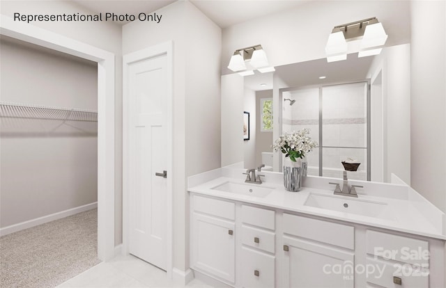 bathroom with vanity and a shower with door