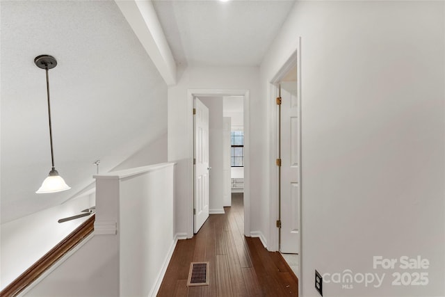 hallway with dark hardwood / wood-style flooring