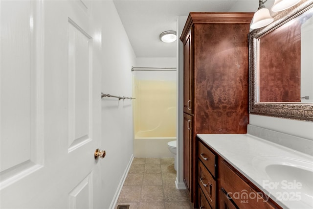 full bathroom featuring vanity, tile patterned flooring, bathtub / shower combination, and toilet