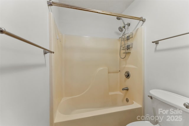 bathroom featuring bathing tub / shower combination and toilet