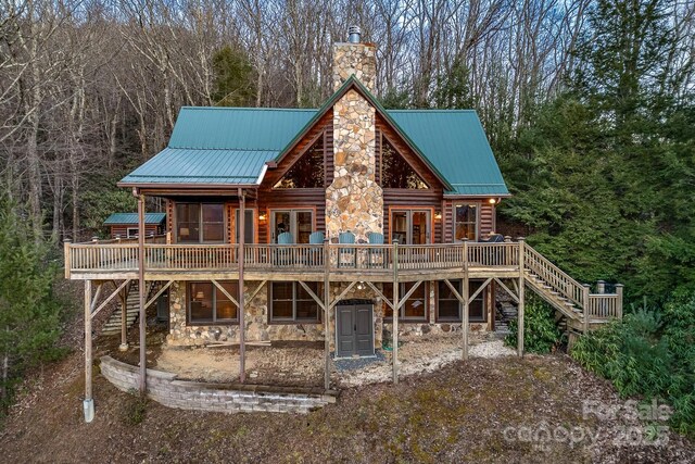 back of property featuring french doors and a deck