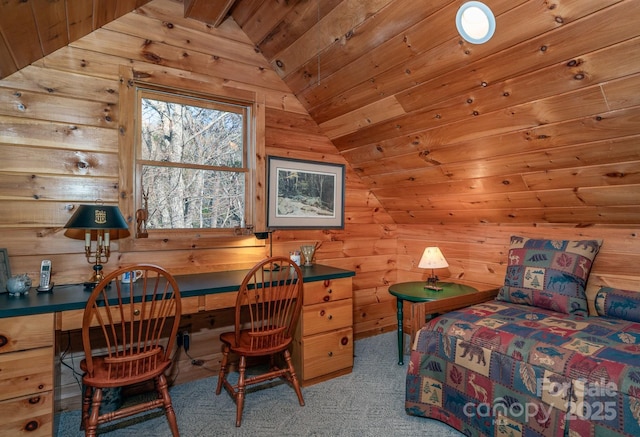 carpeted bedroom featuring lofted ceiling, wooden walls, built in desk, and wooden ceiling